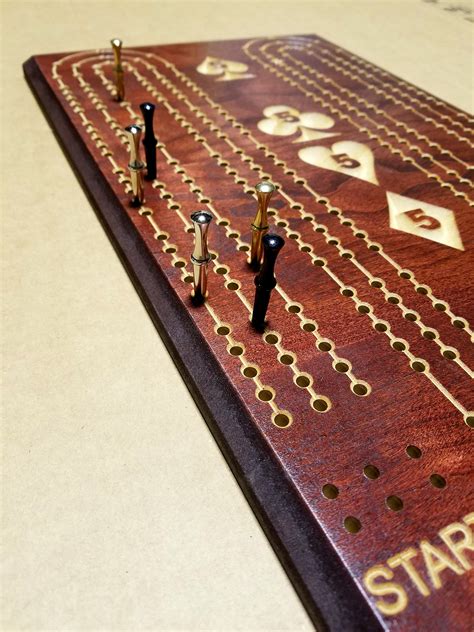 cribbage board with large pegs.